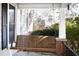 Close-up of a wooden porch swing, perfect for enjoying the outdoors at 2606 W Knox St, Durham, NC 27705