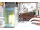 Inviting porch swing on a covered front porch, perfect for relaxation at 2606 W Knox St, Durham, NC 27705