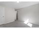 Bedroom featuring neutral carpet, paint, with doors leading to the hallway and a closet at 2612 Glenbrook Dr, Durham, NC 27704