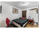 Functional bedroom features hardwood floors, a large bed, and a closet at 2732 Old Milburnie Rd, Raleigh, NC 27604