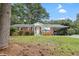 Charming brick home featuring a covered carport and well-maintained front yard at 2732 Old Milburnie Rd, Raleigh, NC 27604