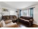 Bright living room featuring hardwood floors, natural light, and comfortable seating at 2732 Old Milburnie Rd, Raleigh, NC 27604
