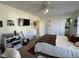 Inviting bedroom features a ceiling fan, neutral paint, and carpet at 305 River Birch Run, Coats, NC 27521