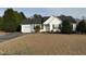 Charming, single-story home features a well-manicured lawn, attached garage and mature landscaping at 305 River Birch Run, Coats, NC 27521