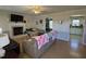 Spacious living room featuring a fireplace and views to kitchen and dining area at 305 River Birch Run, Coats, NC 27521