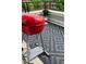 Cozy balcony featuring a red grill, gray patio tiles, and an elegant flower pot at 401 Finsbury St # 301, Durham, NC 27713