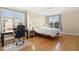 Bedroom with hardwood floors and a bright, inviting atmosphere, with desk area at 401 Finsbury St # 301, Durham, NC 27713