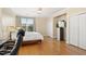 Bright bedroom features hardwood floors, a ceiling fan, and abundant natural light at 401 Finsbury St # 301, Durham, NC 27713