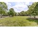 A sprawling green featuring a charming gazebo and mature trees offers a tranquil setting at 401 Finsbury St # 301, Durham, NC 27713