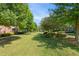 Expansive green space surrounded by mature trees offering a serene setting at 401 Finsbury St # 301, Durham, NC 27713