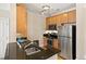 Efficient kitchen layout featuring stainless steel appliances and granite countertops at 401 Finsbury St # 301, Durham, NC 27713