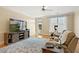 Bright living room with hardwood floors, a large TV, and a comfortable reclining sofa at 401 Finsbury St # 301, Durham, NC 27713