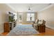 Bright living room with hardwood floors, large TV, comfortable recliner sofa and natural light at 401 Finsbury St # 301, Durham, NC 27713