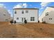 Spacious backyard with cozy patio setup, ideal for outdoor gatherings and relaxation with grill at 456 Highview Dr, Benson, NC 27504