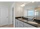 Modern bathroom with dual sinks, granite countertops, and tiled walk-in shower at 456 Highview Dr, Benson, NC 27504