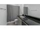 Contemporary bathroom featuring granite countertops and shower with curtain at 456 Highview Dr, Benson, NC 27504
