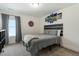 Neutral bedroom with art accents, plush carpet, and a large window at 456 Highview Dr, Benson, NC 27504