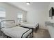 Cozy bedroom with two twin beds and neutral decor at 456 Highview Dr, Benson, NC 27504