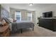 Neutral bedroom featuring plush carpet and a wood accent wall at 456 Highview Dr, Benson, NC 27504