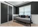 Modern bedroom features a gray accent wall, a sliding closet door, and plush carpeting at 456 Highview Dr, Benson, NC 27504