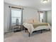 Comfortable bedroom boasts plush carpeting, a large bed, and ample natural light at 456 Highview Dr, Benson, NC 27504
