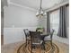 Cozy dining room features modern light fixture, natural rug, and stylish decor at 456 Highview Dr, Benson, NC 27504
