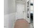 Inviting entryway features wood-look tile floors, board and batten accent wall, and built-in shelving at 456 Highview Dr, Benson, NC 27504