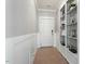 Inviting entryway features wood-look tile floors, board and batten accent wall, and built-in shelving at 456 Highview Dr, Benson, NC 27504