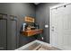 Modern entryway features a floating wood shelf, decorative hooks, and stylish decor at 456 Highview Dr, Benson, NC 27504