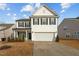 Charming two-story home with black shutters and a two car garage at 456 Highview Dr, Benson, NC 27504