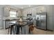 Contemporary kitchen featuring stainless steel appliances, granite counters and a central island at 456 Highview Dr, Benson, NC 27504