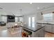 Open layout shows kitchen with island and dining space with living room and fireplace beyond at 456 Highview Dr, Benson, NC 27504