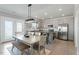Eat-in kitchen features stainless appliances, lots of gray cabinets, and bright light from a French door at 456 Highview Dr, Benson, NC 27504