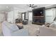 Open living room boasts a fireplace, TV, and plenty of seating for entertaining at 456 Highview Dr, Benson, NC 27504