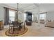Open-concept living area with dining space, fireplace, neutral tones and ample natural light at 456 Highview Dr, Benson, NC 27504