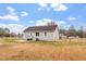 Back exterior of home featuring a spacious yard with a patio at 4610 Lemon Heights Dr, Sanford, NC 27332