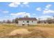Back exterior of home featuring a spacious yard with a patio and a chain link fence at 4610 Lemon Heights Dr, Sanford, NC 27332