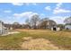 Large backyard with plenty of space for outdoor activities and storage sheds at 4610 Lemon Heights Dr, Sanford, NC 27332