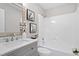 Clean bathroom with a stylish vanity, framed mirror, and a shower-tub combination at 4610 Lemon Heights Dr, Sanford, NC 27332