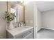 Bright bathroom showcasing a stylish vanity with a gold-framed mirror and modern sink at 4610 Lemon Heights Dr, Sanford, NC 27332