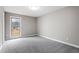 Cozy bedroom features plush carpeting, neutral paint, ample natural light, and closet space at 4610 Lemon Heights Dr, Sanford, NC 27332