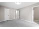Spacious bedroom features plush carpeting, neutral paint, ample natural light, and access to a bathroom at 4610 Lemon Heights Dr, Sanford, NC 27332