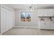 Bright dining area features modern light fixture, large window, and white cabinets with beautiful countertops at 4610 Lemon Heights Dr, Sanford, NC 27332