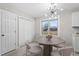 Cozy dining area features modern lighting, a round table, and a window at 4610 Lemon Heights Dr, Sanford, NC 27332