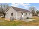 Rear exterior with siding, access to yard, patio, and chain link fence at 4610 Lemon Heights Dr, Sanford, NC 27332