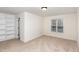 Bright bedroom with carpet, built-in shelving, and large window that offers natural light at 4618 Pooh Corner Dr, Raleigh, NC 27616