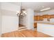 Open dining room boasts hardwood floors, decorative chandelier, and easy access to the kitchen at 4618 Pooh Corner Dr, Raleigh, NC 27616