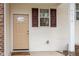 Exterior view of front door with brown door with glass and brown shutters at 4618 Pooh Corner Dr, Raleigh, NC 27616