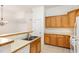 Kitchen with tile flooring, breakfast bar, and light wood cabinets at 4618 Pooh Corner Dr, Raleigh, NC 27616