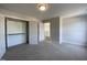 Bedroom featuring closet, neutral carpeting and white trim at 4881 Grosbeak Ct, Mebane, NC 27302